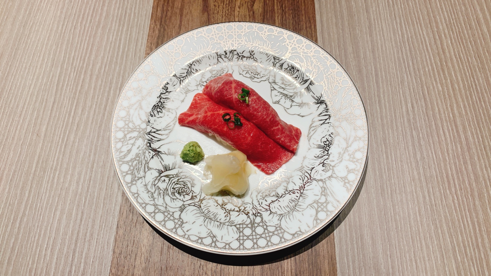 Two servings of meat sushi made with Kuroge Wagyu beef